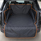 Beagle sitting on waterproof car trunk mat, orange edge