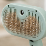 Close-up of the grooming brush bristles removing loose fur